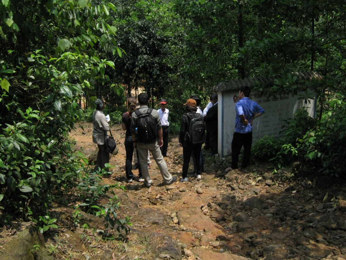 Vietnam forest. Credit: Lucile Robonson Small group of people gathered in a clearing in the forest, Vietnam.