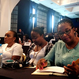 Cecilia Silva and Carla Silva Pompilio from Angola, browsing through ‘Becoming a UNFCCC delegate’, Marrakech, November 2017 (Photo: Janna Tenzing/IIED)