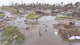 Aerial view of flooded village and destroyed housing