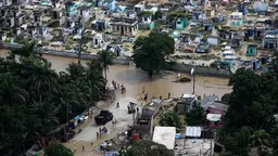 Aerial view of a flooded city with destroyed housing and infrastructure
