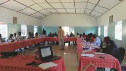 People sitting around a u-shaped table