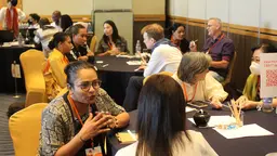 Groups of people talking to each other