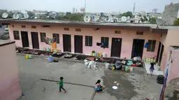Informal housing block with children playing in front
