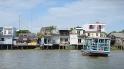 Houses on stilts along a river