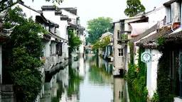 Houses next to a canal.