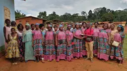 A man standing next to a group of women.