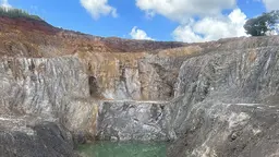 Landscape with a mine and blue sky.