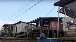 Image of a few houses from a floating village