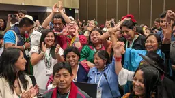 Members of the International Indigenous Forum on Biodiversity celebrate the adoption of the decision on the new Subsidiary Body for Indigenous Peoples and Local Communities at the closing plenary of COP16.
