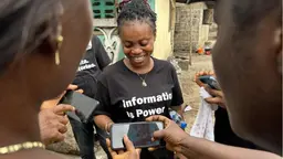 Group of community members recording via interviews via their phones.