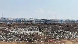 Site of a forced eviction of an informal settlement in Lagos, Nigeria. Person walking through the settlement.