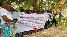 Team members from CODEC gathered for a presentation, holding a big banner.