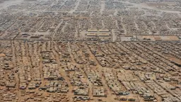 Aerial view of the Zaatari refugee camp showing informal housing set up and spread over a large space.