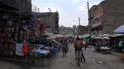 People walk along a street.