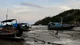 Fishing boats on the shore in Thailand.