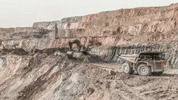 Image of trucks working in a copper mine