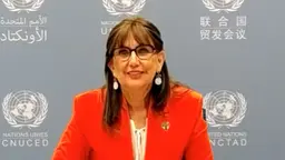A woman delivers a lecture online.