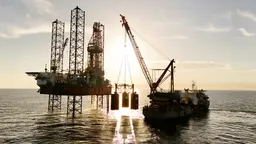 Oil rig being serviced by a supply ship in Mexico.