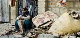 A woman sells cardboard on the streets of Karachi, Pakistan.