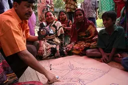 Participants study a map in Bangladesh. Photo: Isabelle Lemaire