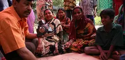 A community in Bangladesh maps out their local resources and plans for an emergency.