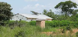 House in Zambia with solar panels on the roof.