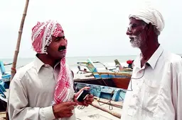 Men practice an oral testimony interview during workshops in Karachi, Pakistan (see Article 4 of PLA 63) Photo credit: Panos, London