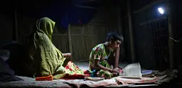 In the absence of electricity, students in Bangladesh are given charger lights so they can study at home (Photo: G.M.B. Akash/PANOS)