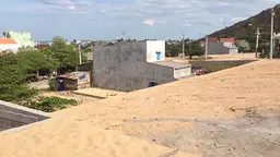 New construction sites for housing have been prepared by the government on the hillside above Nhon Hai, but the compensation isn't enough to let people move (Photo: David Dodman/IIED)