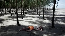 A Bangladeshi fisherman sleeps under a tree, one of thousands planted by the government in an attempt to slow tidal erosion and shield against winds as the country. As countries take such measures to tackle climate change, negotiators prepare for the road to Paris and COP21 (Photo: Espen Rasmussen/PANOS)