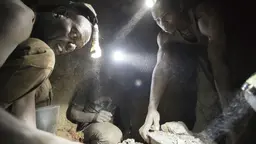 Miners work deep within a tunnel at Nsangano gold mine in the Geita District (Photo: copyright Brian Sokol/Panos Pictures)