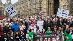 Campaigners celebrate the UK becoming the first G7 country to enshrine in law the UN-agreed target of spending 0.7 per cent of GDP on oversea aid (Photo: UNA-UK via Google licence)