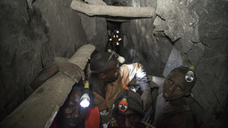 Employees work deep within a tunnel at the Nsangano Gold Mine, Mawemeru village in Geita District, Tanzania in March 2015 (Photo: Brian Sokol/Panos Pictures)