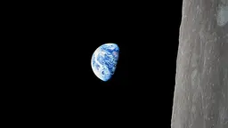 The first photograph taken of Earthrise by Apollo 8 in December 1968. The Apollo Programme to Combat Climate Change proposes large-scale public investment and determined political effort from powerful states to take down carbon energy sources (Photo: NASA/woodleywonderworks, Flickr, via Creative Commons)