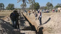 Residents of Tsandi, a settlement in the Omusati region of northern Namibia, look at the community-led sanitation installation for houses being built by the Shack Dwellers' Federation of Namibia (Photo: Diana Mitlin/IIED)
