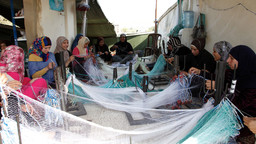 Syria refugees in Lebanon learn how to make fishing nets, a skill which will help them find work along the northern coast (Photo: DFID, Creative Commons, via Flickr)