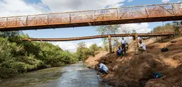 Testing the water in Kenya's Tana River watershed. The river's ecosystem is being affected by a range of factors. Public and private organisations are exploring ways to improve ecosystem management (Photo: Georgina Smith/CIAT, Creative Commons via Flickr)