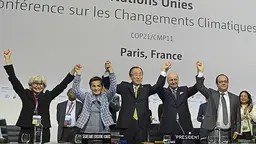 COP21 president Laurent Fabius (second right) and UNFCCC executive secretary Christiana Figueres (second left) celebrate the Paris Agreement (Photo: UNclimatechange, Creative Commons via Flickr)