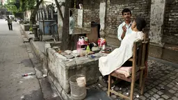 A street barber in Kolkata, India. It is estimated that the city has nearly 2m street traders (Photo: Nicolas Mirguet, Creative Commons via Flickr)