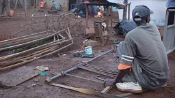 A welder uses home-made equpiment in Kenya, where the Jua Kali (informal economy) thrives and can solve any problem (Photo: Erik (HASH) Hersman, Creative Commons, via Flickr)