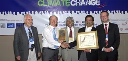 Conference organiser Saleemul Huq receives the "Burtoni" award: from left to right: Ian Burton (IPCC lead author), Roger Jones (CSIRO), Atiq Rahman (BCAS), Saleemul Huq (IIED) and Richard Klein (SEI) (Photo: IISD)