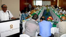 An image of Mohammad Sayedul Haque, the Bangladesh Minister of Fisheries and Livestock alongside a table around which sit participants from Bangladesh, Myanmar and India as they discuss sustainable hilsa fishery management (Photo: Essam Yassin Mohammed/IIED)