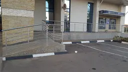 An image of the outside of a Malawi bank, showing a ramp installed for wheelchair users. Generally the country is lagging behind in terms of provisions for people with disabilities (Photo: Steve Sharra)