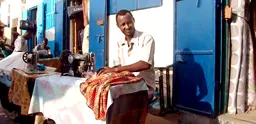 Sewing on the street in Djibouti. The informal sector still plays an important role in most of the LDCs (Photo: Charles Roffey, Creative Commons via Flickr)