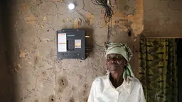 Sixty-two-year-old Elizabeth Mukwimba has a solar-powered lighting system. She no longer has to buy expensive kerosene and has been able to use the savings to re-roof her house (Photo: Russell Watkins/Department for International Development)