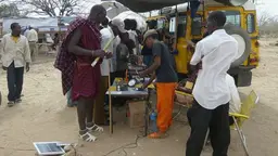 A demonstration of solar PV products by the Energy and Environment Partnership in Tanzania's southern Iringa Region gathers an audience of all ages (Photo: EEP Southern and Eastern Africa, Creative Commons via Flickr)