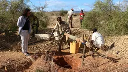 Sapphire pits to be rehabilitated in Anikilabo, shown during the site visit of the major of a local mining community, Ampasy Nahampoana (Photo: Andry Rabemanantsoa/GIZ PAGE Madagascar)