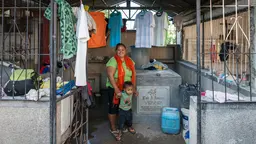 A family living in a cemetery in Cebu City, the Philippines. A lack of affordable housing has led some 100 families to set up home among the mausoleums (Photo: Karl Fluch, Creative Commons via Flickr)