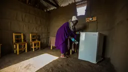 Esilalei, Tanzania: Teresia Olotai uses a refrigerator plugged into a solar powered micro-grid. Delivering energy access in rural Tanzania could help transform local economies (Photo: Morgana Wingard, USAID, Creative Commons via Flickr)