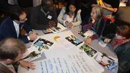 Participants around a table at D&C Days 2016 (Photo: Matt Wright/IIED)